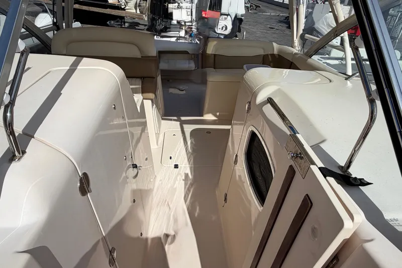 Slide: The Image of 2013 Grady-White Freedom 335 boat with Garmin radar under clear blue sky. - 91