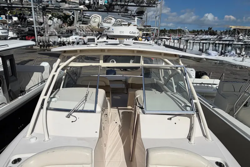 Slide: The Image of 2013 Grady-White Freedom 335 boat with spacious, cushioned seating area. - 94