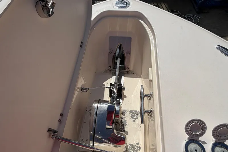 Slide: The Image of Luxurious seating area on a 2013 Grady-White Freedom 335 boat, docked at a marina. - 97