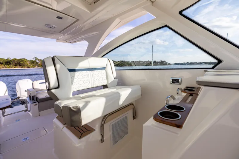 Slide: The Image of Luxurious interior of 2022 Tiara 34 LX boat with comfortable seating and cup holders. - 25