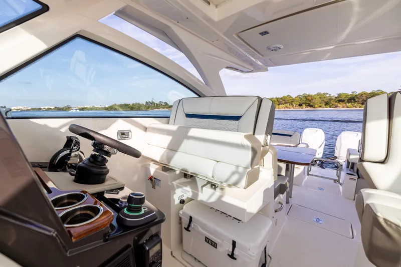Slide: The Image of Interior of 2022 Tiara 34 LX yacht with modern helm and seating. - 26