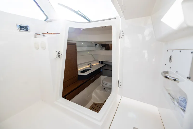 Slide: The Image of Interior view of 2022 Tiara 34 LX yacht bathroom with modern fixtures. - 30