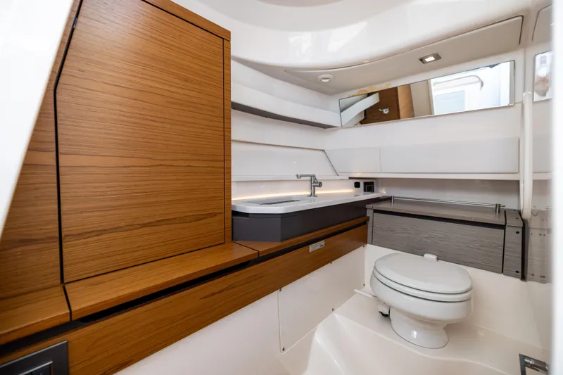 Slide: The Image of Luxurious 2022 Tiara 34 LX yacht bathroom with modern wood and white design. - 32