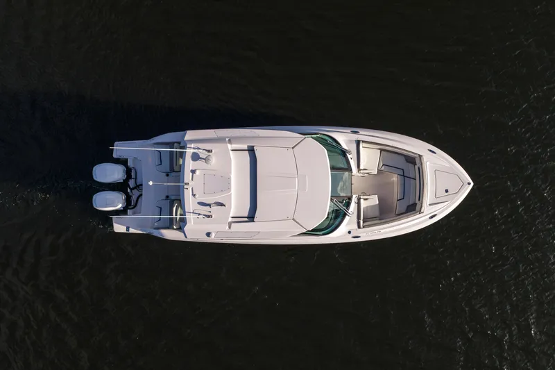 Slide: The Image of Aerial view of 2022 Tiara 34 LX boat on dark water. - 42