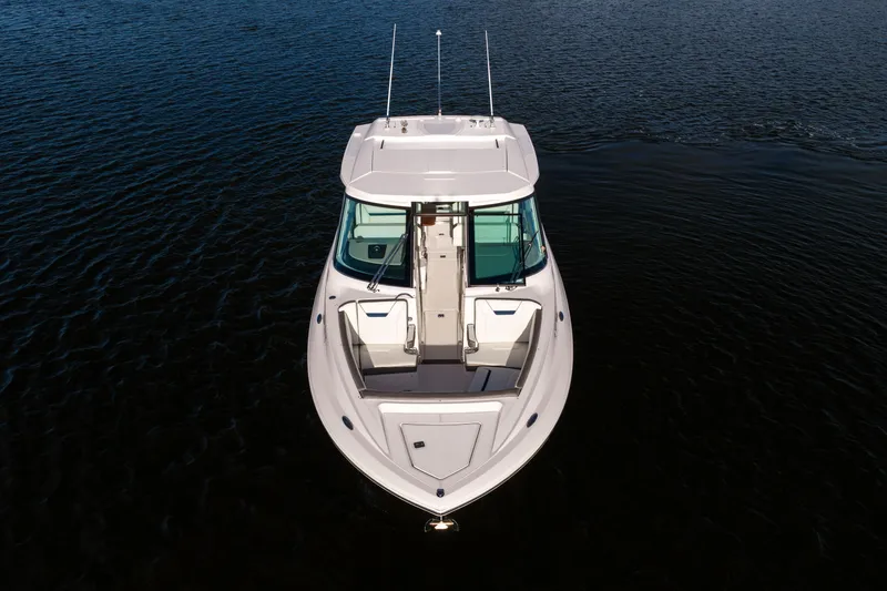 Slide: The Image of 2022 Tiara 34 LX boat on calm water, aerial view. - 43