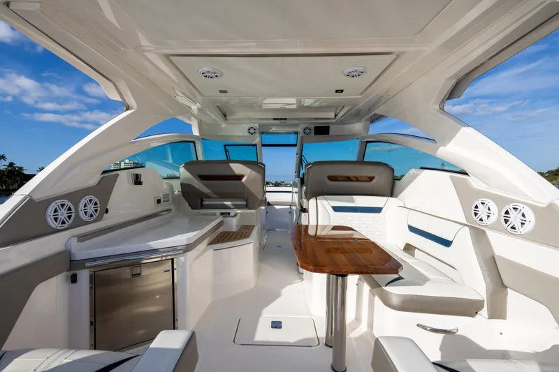 Slide: The Image of Interior of 2022 Tiara 34 LX yacht with modern seating and sleek design. - 8