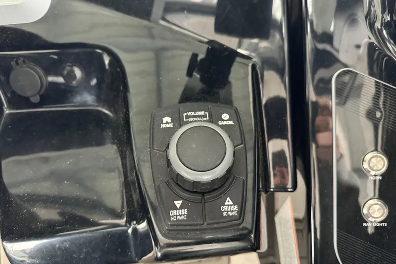 Slide: The Image of Control panel of 2024 Yamaha Boats 275SD with cruise and volume settings. - 11