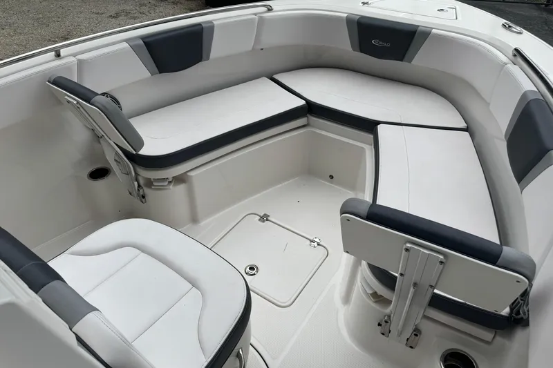 Slide: The Image of 2021 Robalo R230 Center Console boat interior with cushioned seating. - 10