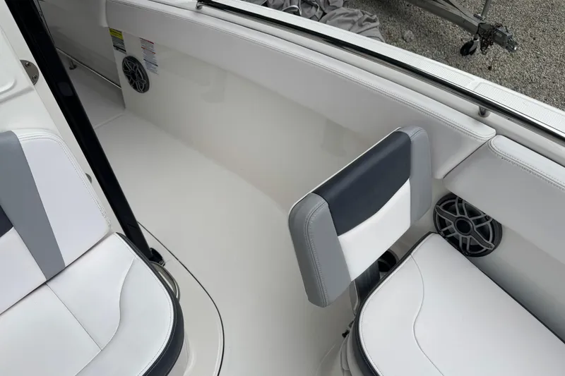 Slide: The Image of 2021 Robalo R230 Center Console boat interior with white and gray seating. - 12