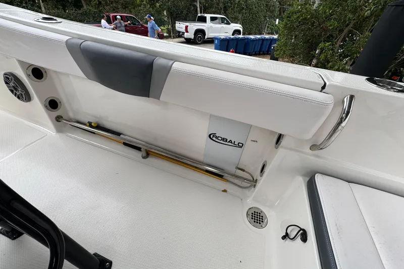 Slide: The Image of 2021 Robalo R230 Center Console boat interior with seating and storage. - 18