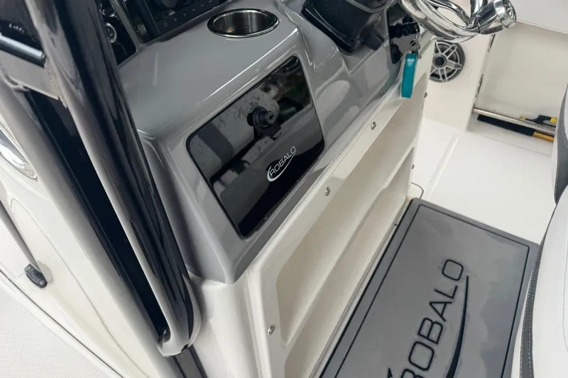 Slide: The Image of 2021 Robalo R230 Center Console interior with steering wheel and branded mat. - 25
