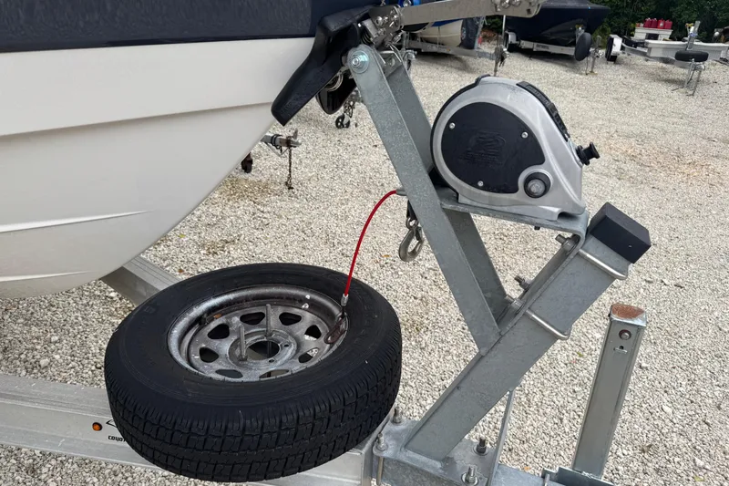 Slide: The Image of 2021 Robalo R230 Center Console boat trailer with spare tire and winch. - 27