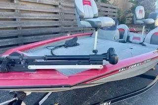 Slide: The Image of 2013 Tracker Pro Team 175 TXW fishing boat with red trim and seating. - 4