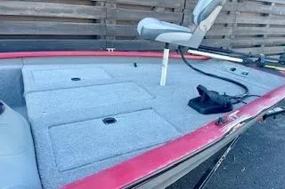 Slide: The Image of 2013 Tracker Pro Team 175 TXW fishing boat with elevated seat and storage compartments. - 6