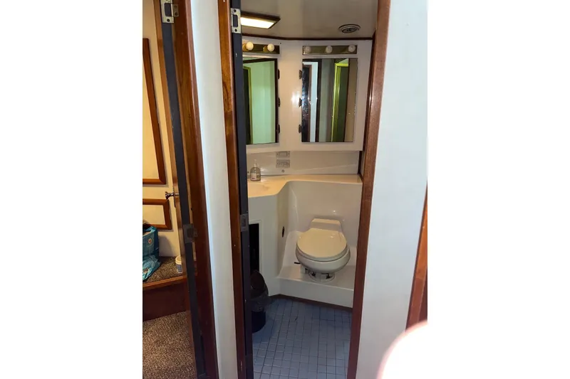 Slide: The Image of Bathroom interior of 1989 Topaz 44 Sportfisherman yacht, featuring compact design and modern amenities. - 18