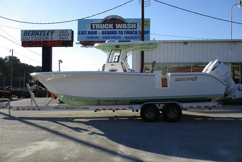 The Image of 2026 Sea Pro 292 Offshore boat on trailer at outdoor dealership. - 1