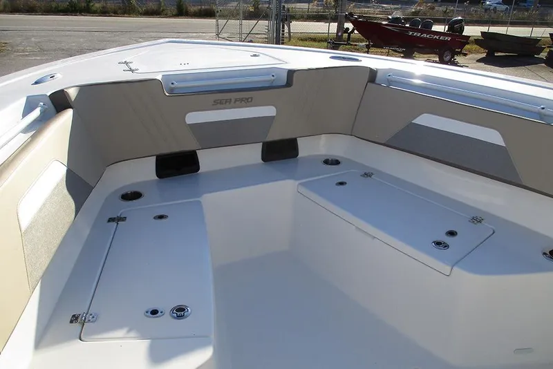 Slide: The Image of 2026 Sea Pro 292 Offshore boat interior with storage compartments and seating. - 17