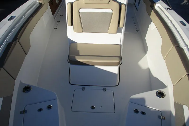 Slide: The Image of 2026 Sea Pro 292 Offshore boat interior with cushioned seating and storage compartments. - 21