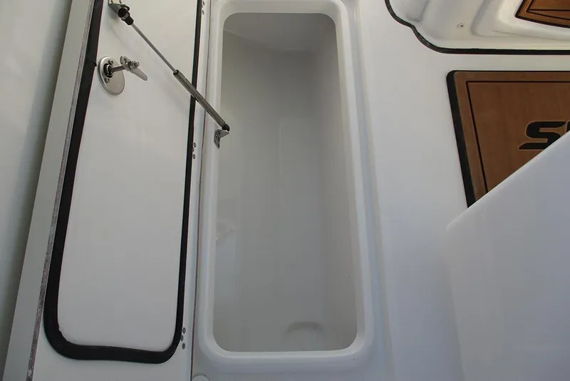 Slide: The Image of 2026 Sea Pro 292 Offshore boat storage compartment with open hatch. - 26