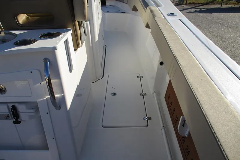 Slide: The Image of 2026 Sea Pro 292 Offshore boat interior with seating and storage compartments. - 27