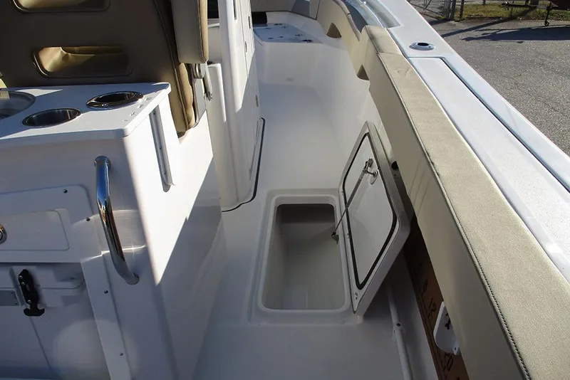 Slide: The Image of 2026 Sea Pro 292 Offshore boat interior with open storage compartment and seating. - 28
