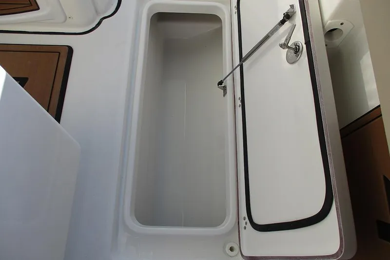 Slide: The Image of Open storage compartment on 2026 Sea Pro 292 Offshore boat. - 29