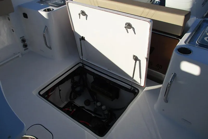 Slide: The Image of Open hatch on 2026 Sea Pro 292 Offshore boat, revealing internal storage compartment. - 32