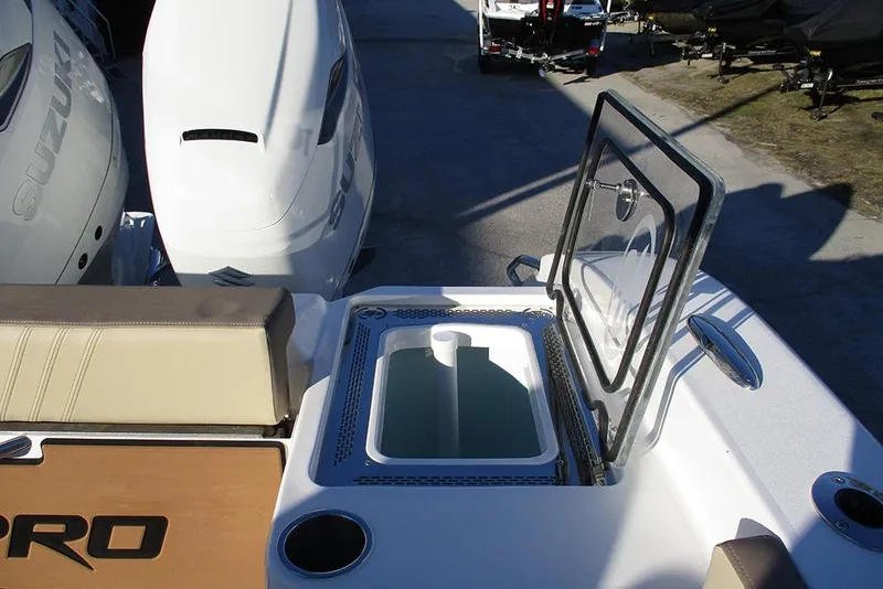 Slide: The Image of 2026 Sea Pro 292 Offshore boat with open hatch and dual Suzuki outboard engines. - 35