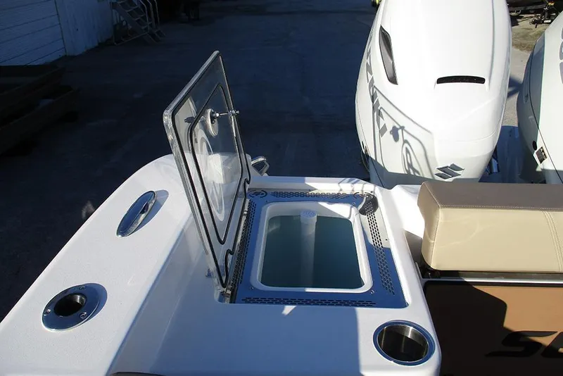 Slide: The Image of 2026 Sea Pro 292 Offshore boat with open hatch and dual engines. - 38