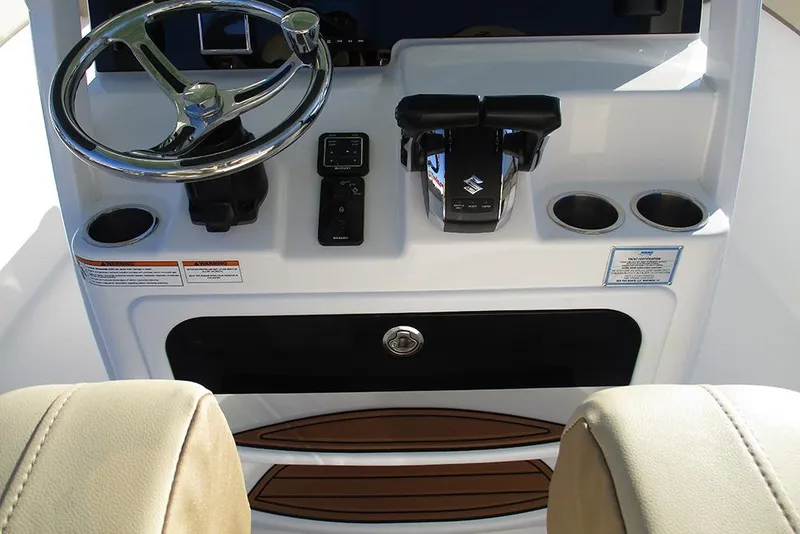 Slide: The Image of 2026 Sea Pro 292 Offshore boat helm with steering wheel and controls. - 48