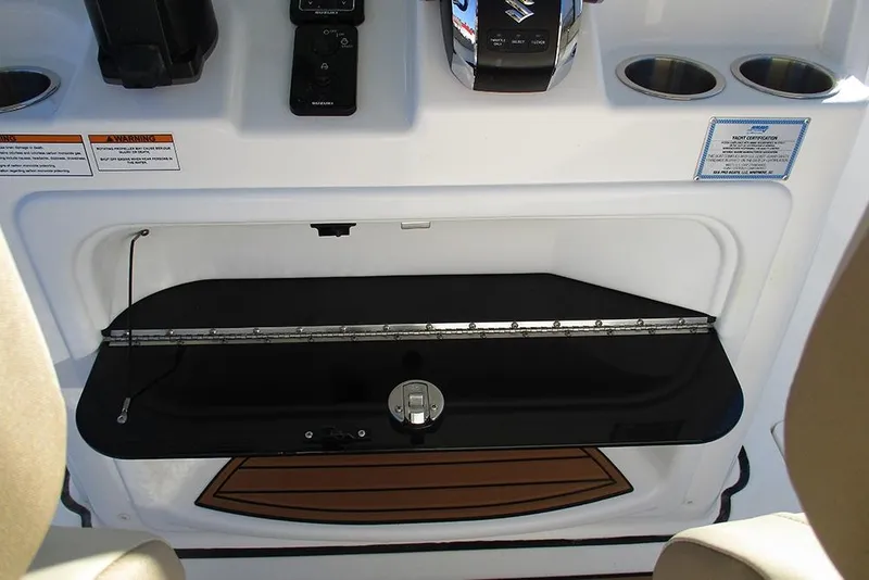 Slide: The Image of 2026 Sea Pro 292 Offshore boat console with controls and cup holders. - 49