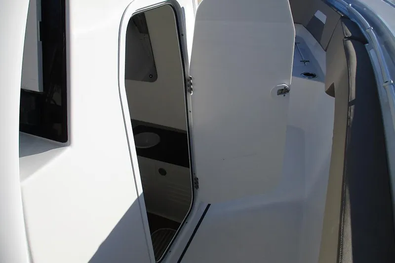 Slide: The Image of 2026 Sea Pro 292 Offshore boat interior with open cabin door. - 52