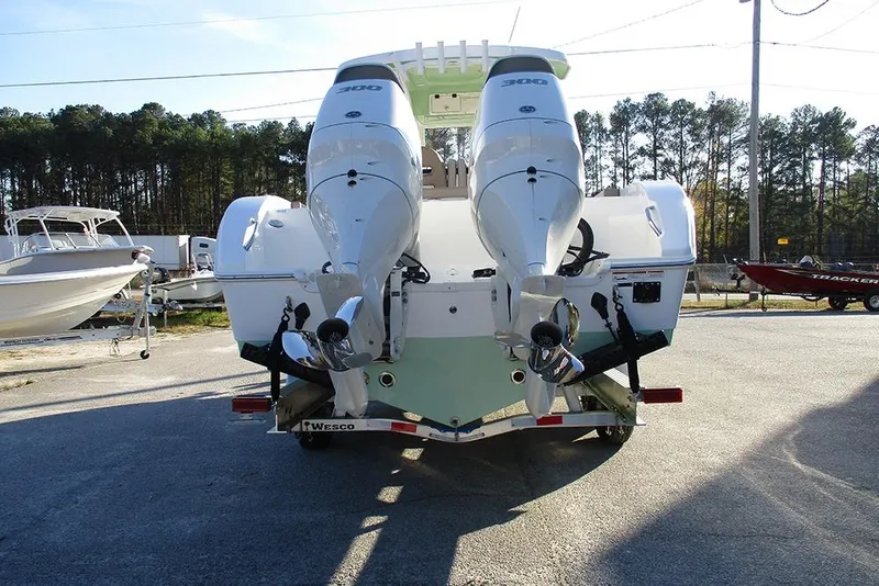 Slide: The Image of 2026 Sea Pro 292 Offshore boat with dual engines on a trailer. - 8