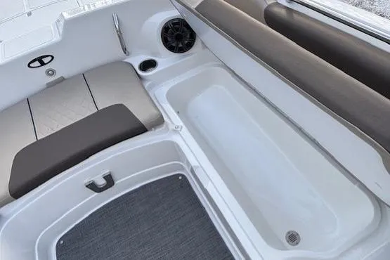 Slide: The Image of 2025 Tahoe 2150 boat interior with seating and storage compartments. - 10