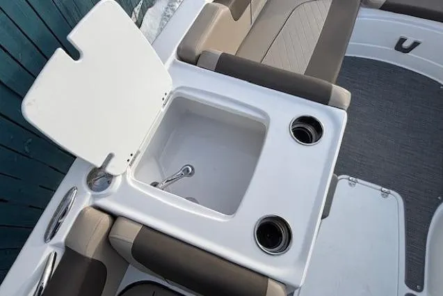 Slide: The Image of 2025 Tahoe 2150 boat interior with sink and cup holders. - 13