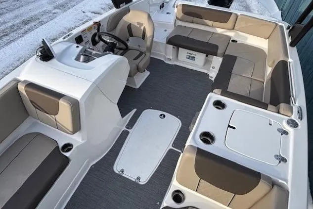 Slide: The Image of 2025 Tahoe 2150 boat interior with spacious seating and modern helm design. - 18