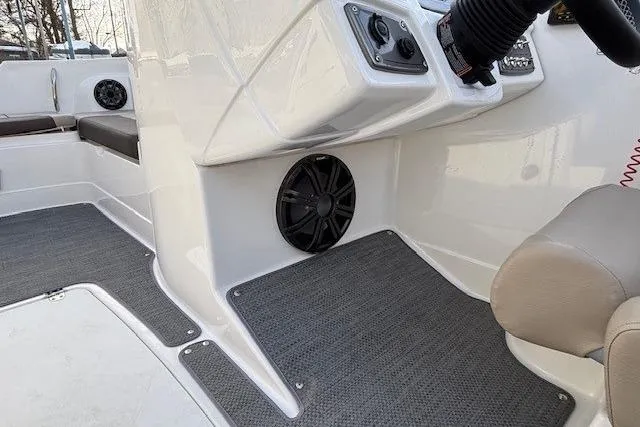 Slide: The Image of 2025 Tahoe 2150 boat interior with speaker and seating area. - 23