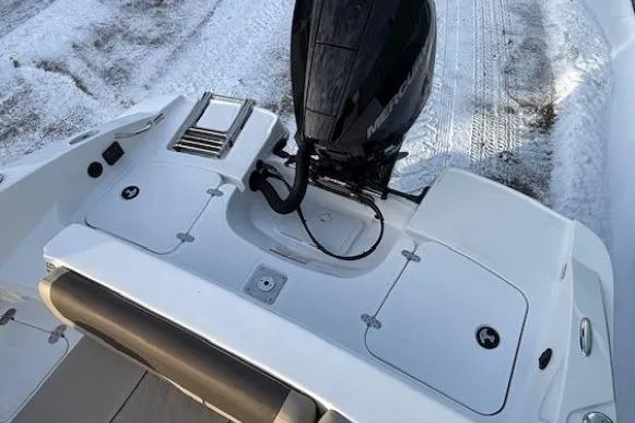 Slide: The Image of 2025 Tahoe 2150 boat with outboard motor on snowy ground. - 33