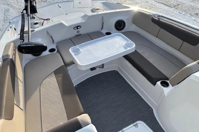 Slide: The Image of 2025 Tahoe 2150 boat interior with seating and table, featuring modern design and comfort. - 8