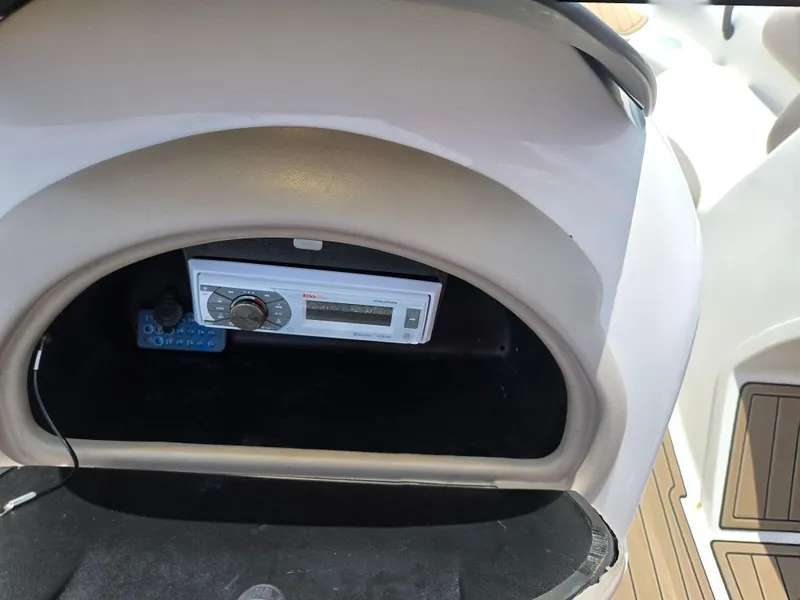 Slide: The Image of 2001 Yamaha LS 2000 boat dashboard with stereo system. - 12