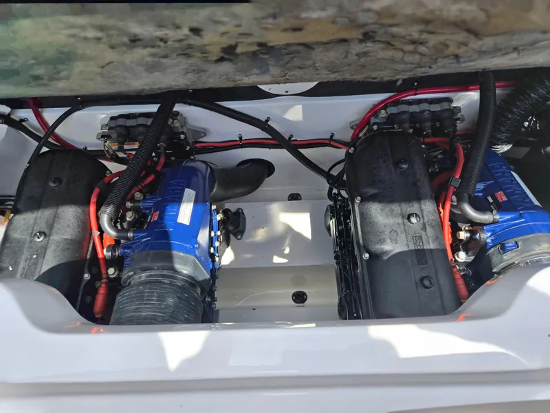 Slide: The Image of 2001 Yamaha LS 2000 boat engine compartment with dual engines and red wiring. - 22