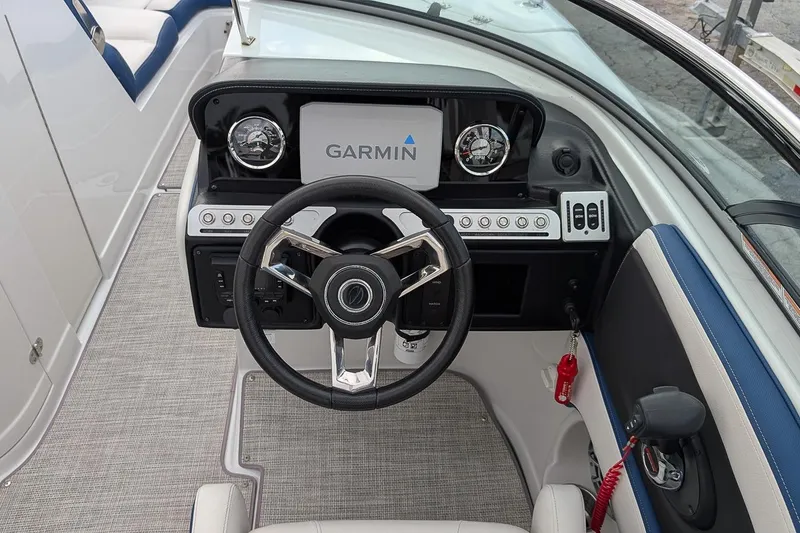 Slide: The Image of 2022 Crownline 260 XSS boat dashboard with Garmin navigation system and modern controls. - 12