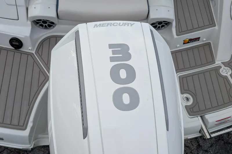 Slide: The Image of 2022 Crownline 260 XSS boat with Mercury 300 engine, featuring sleek deck design. - 4