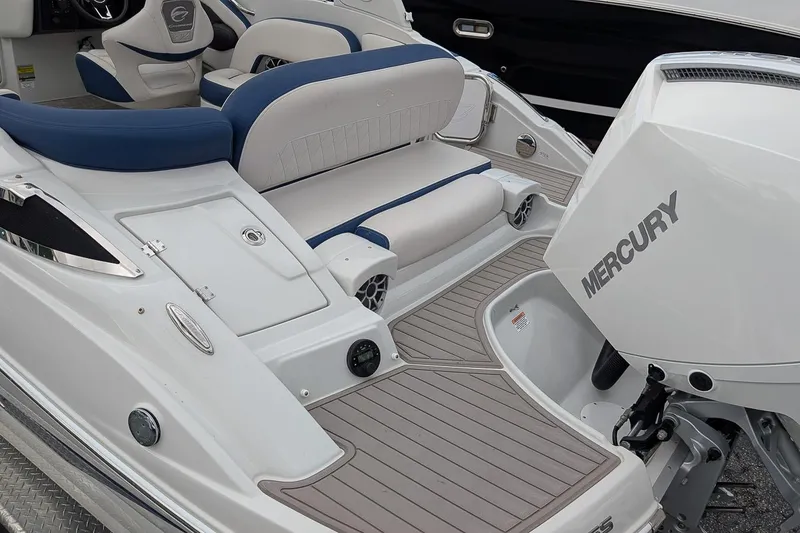 Slide: The Image of 2022 Crownline 260 XSS boat with Mercury engine, featuring sleek seating and modern design. - 5