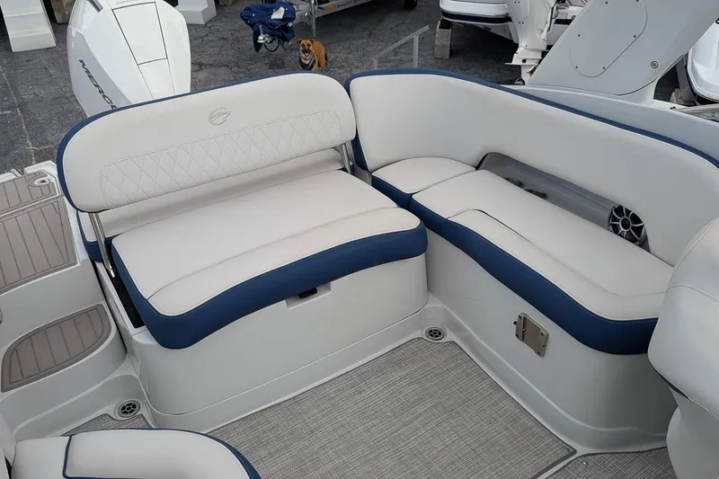 Slide: The Image of 2022 Crownline 260 XSS boat interior with white and blue seating. - 7