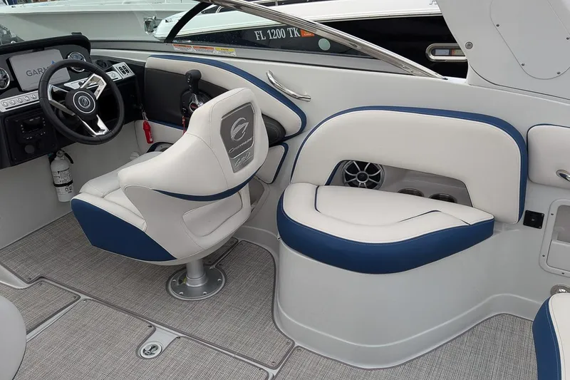 Slide: The Image of 2022 Crownline 260 XSS boat interior with modern helm and seating. - 8