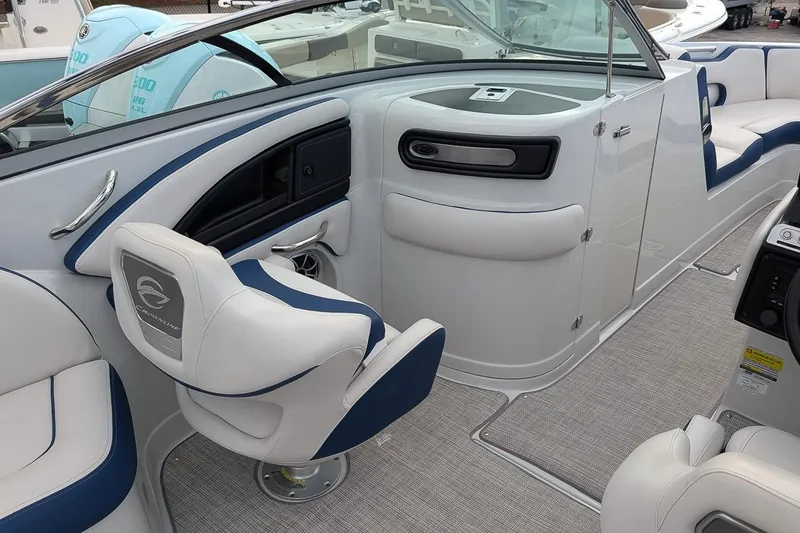 Slide: The Image of 2022 Crownline 260 XSS boat interior with modern seating and sleek design. - 9
