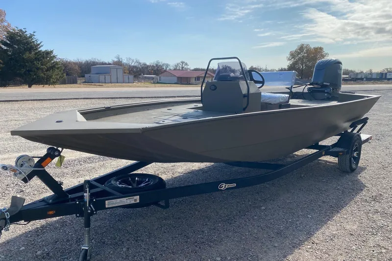 Slide: The Image of 2026 G3 Gator Tough 20 CCJ boat on trailer, outdoor setting, clear sky. - 3