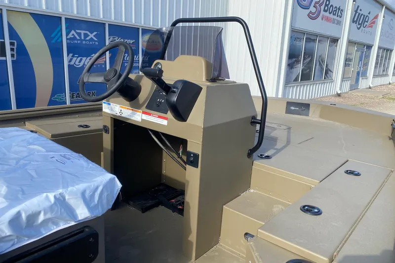 Slide: The Image of 2026 G3 Gator Tough 20 CCJ boat interior with steering console, displayed at dealership. - 7
