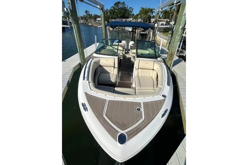 Slide: The Image of 2019 Regal 29 OBX boat docked, featuring spacious seating and sleek design. - 18